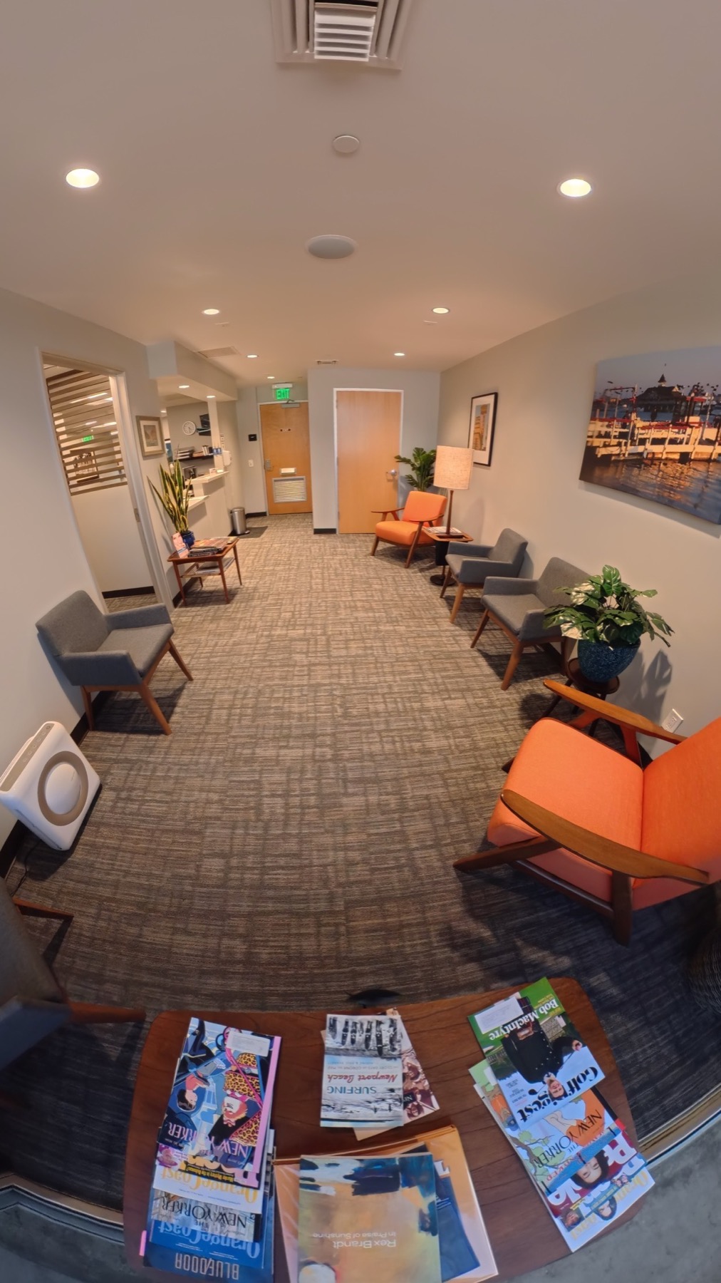 Vertical view of the bright patient reception and waiting area